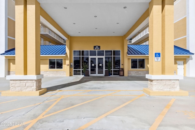 property entrance featuring french doors