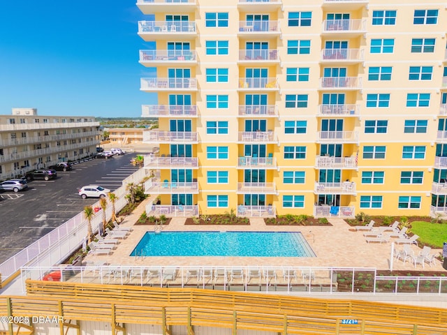 view of pool featuring a patio