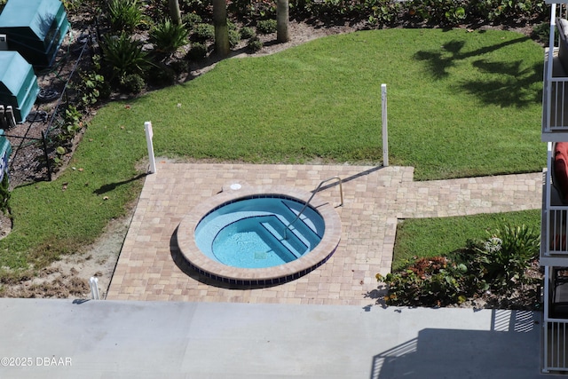 view of swimming pool featuring an in ground hot tub and a patio