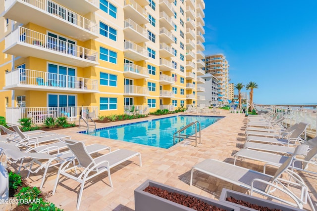 view of swimming pool featuring a patio area