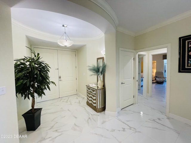 1925 S Atlantic Ave Unit 411, Daytona Beach Shores, FL 32118 - hall with ornamental molding, baseboards, and marble finish flooring