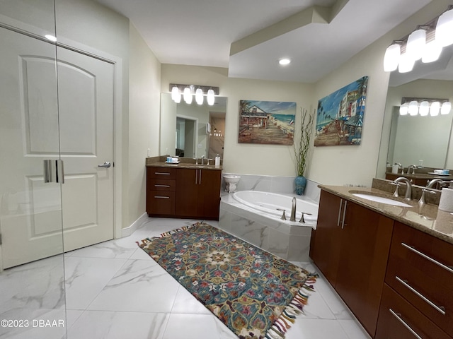 1925 S Atlantic Ave Unit 411, Daytona Beach Shores, FL 32118 - bathroom with two vanities, a bath, marble look tiles, and baseboards