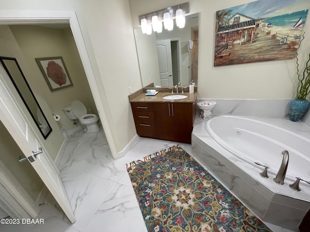 1925 S Atlantic Ave Unit 411, Daytona Beach Shores, FL 32118 - bathroom with toilet, vanity, a tub with jets, marble look tiles, and baseboards