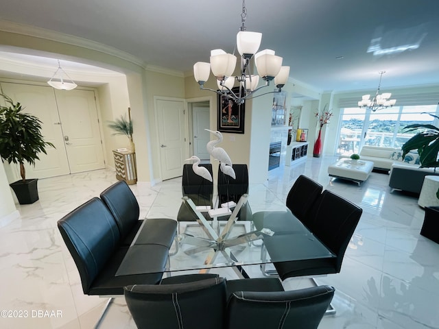 1925 S Atlantic Ave Unit 411, Daytona Beach Shores, FL 32118 - dining room featuring a chandelier, light marble finish floors, crown molding, and baseboards