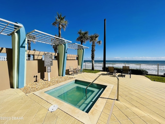 1925 S Atlantic Ave Unit 411, Daytona Beach Shores, FL 32118 - view of pool with a community hot tub and a water view