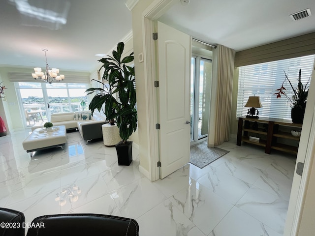 1925 S Atlantic Ave Unit 411, Daytona Beach Shores, FL 32118 - foyer entrance with a chandelier and baseboards