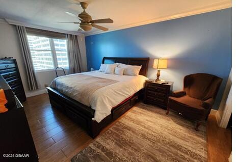 bedroom with wood-type flooring and ceiling fan