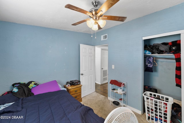 bedroom with a closet, carpet flooring, and ceiling fan