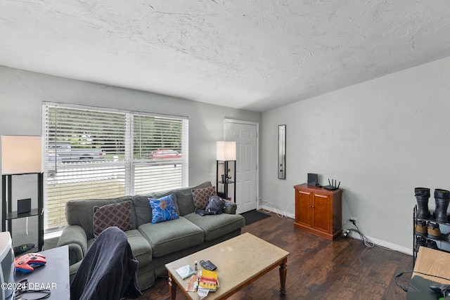 living room with dark hardwood / wood-style flooring, a textured ceiling, and vaulted ceiling