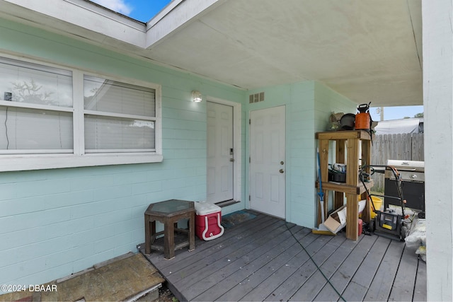 doorway to property featuring a deck