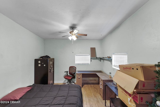 bedroom featuring light hardwood / wood-style flooring and ceiling fan