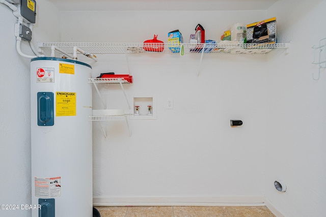 clothes washing area featuring hookup for an electric dryer, tile patterned floors, hookup for a washing machine, and water heater