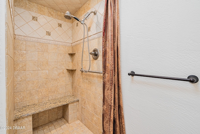 bathroom featuring tiled shower