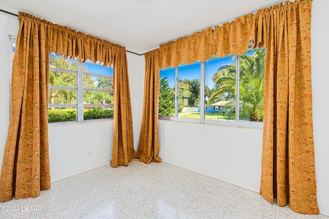 empty room featuring plenty of natural light