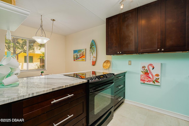 kitchen with light stone counters, dark brown cabinetry, decorative light fixtures, and black range with electric cooktop