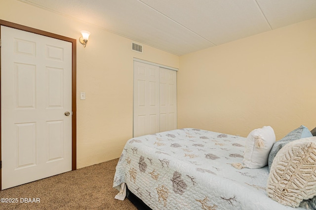 carpeted bedroom with a closet