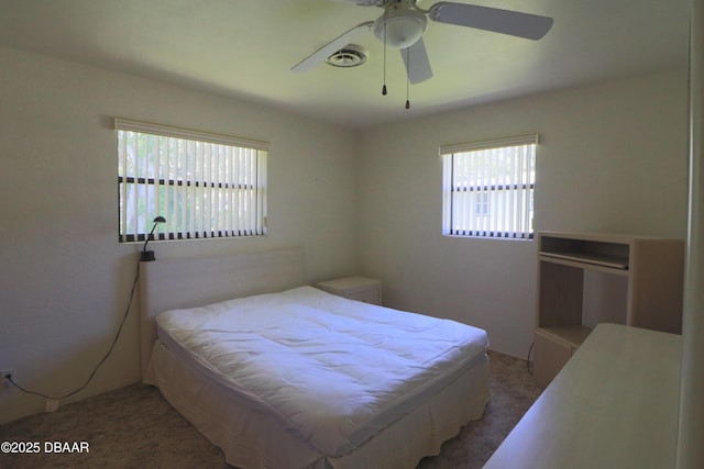 17 Putnam Ave, Ormond Beach, FL 32174 - carpeted bedroom with multiple windows and a ceiling fan