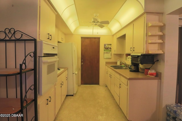 17 Putnam Ave, Ormond Beach, FL 32174 - kitchen with white appliances, a ceiling fan, open shelves, light countertops, and white cabinets