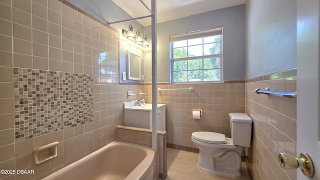 full bath featuring a wainscoted wall, toilet, tile walls, vanity, and tile patterned flooring