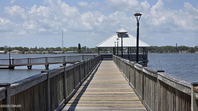 dock area with a gazebo and a water view