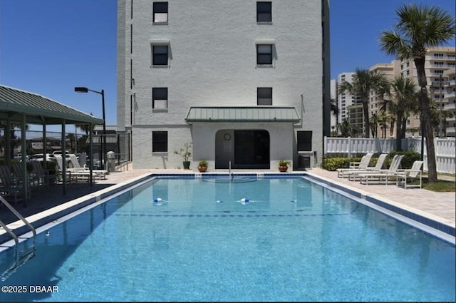 view of swimming pool featuring a patio