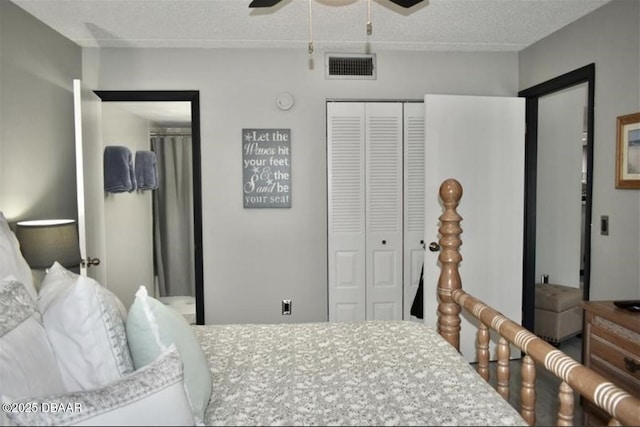 bedroom featuring ceiling fan and a textured ceiling