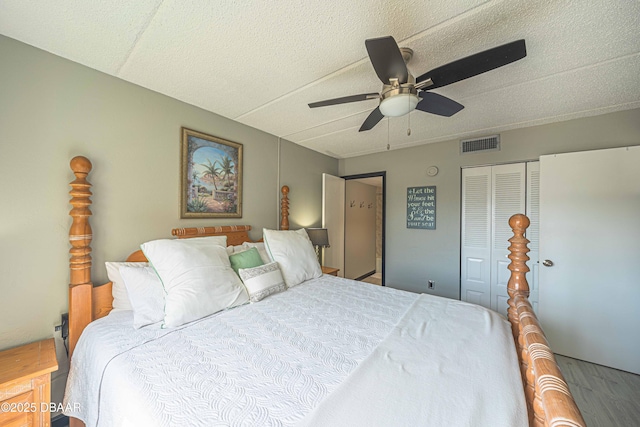 3800 S Atlantic Ave Unit 3030, Daytona Beach, FL 32118 - bedroom with wood finished floors, a ceiling fan, a closet, and a textured ceiling