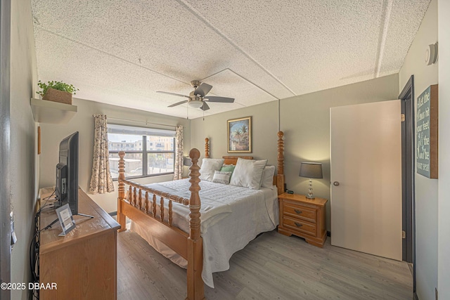 3800 S Atlantic Ave Unit 3030, Daytona Beach, FL 32118 - bedroom featuring light wood-style floors, ceiling fan, and a textured ceiling