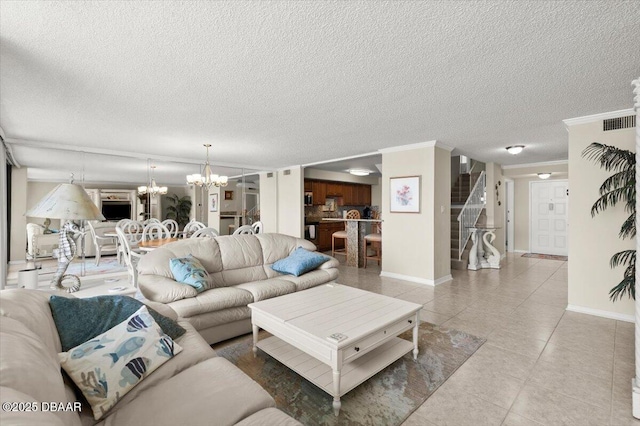901 S Atlantic Ave Unit 202, Ormond Beach, FL 32176 - living room featuring a chandelier, light tile patterned floors, crown molding, a textured ceiling, and stairway