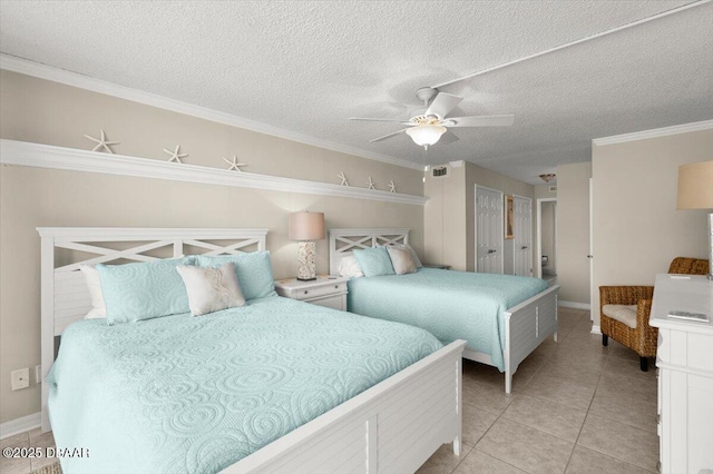 901 S Atlantic Ave Unit 202, Ormond Beach, FL 32176 - bedroom with light tile patterned floors, crown molding, a textured ceiling, and ceiling fan