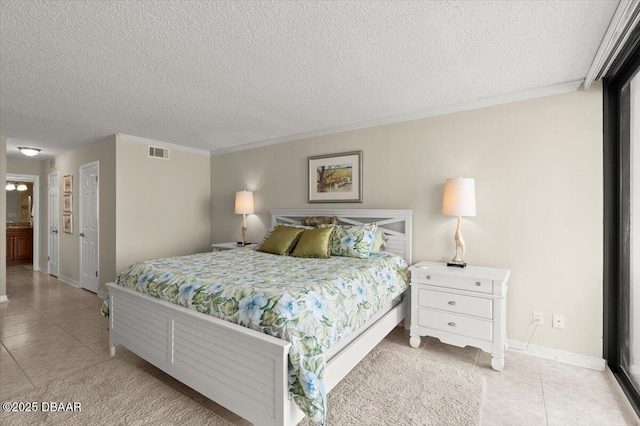 901 S Atlantic Ave Unit 202, Ormond Beach, FL 32176 - bedroom with tile patterned floors, a textured ceiling, and ornamental molding