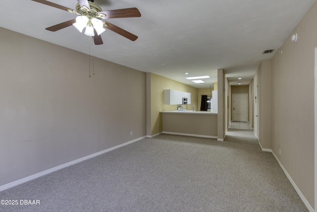 carpeted spare room featuring sink