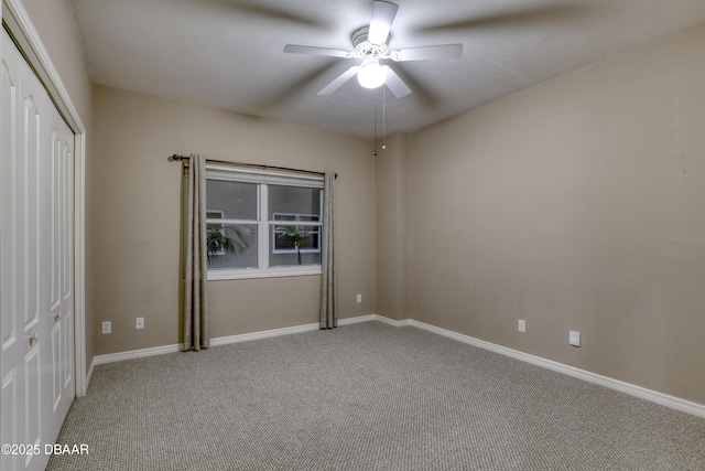 unfurnished bedroom with carpet floors, ceiling fan, and a closet