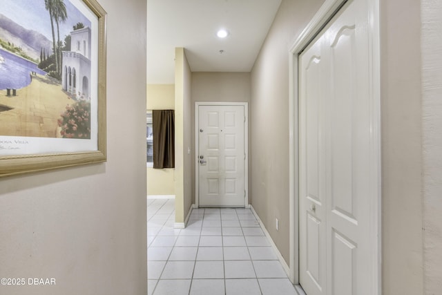 hallway with light tile patterned floors