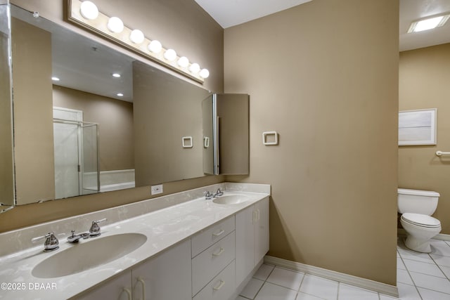 bathroom featuring tile patterned flooring, vanity, an enclosed shower, and toilet