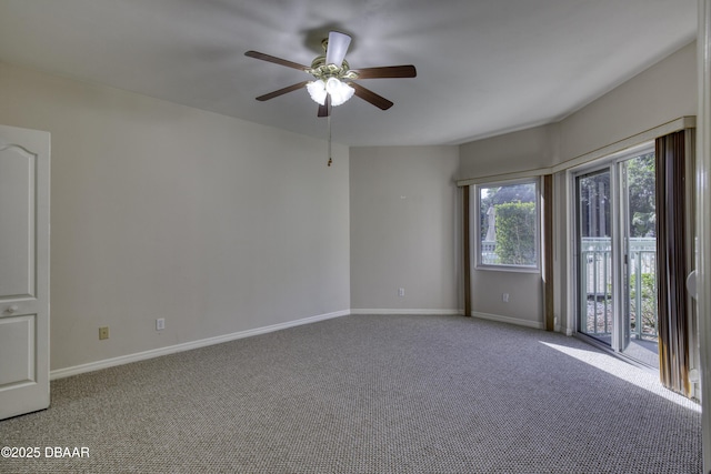 unfurnished room with ceiling fan and carpet flooring