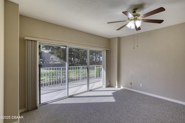 empty room with ceiling fan and carpet floors