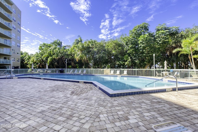 view of swimming pool with a patio