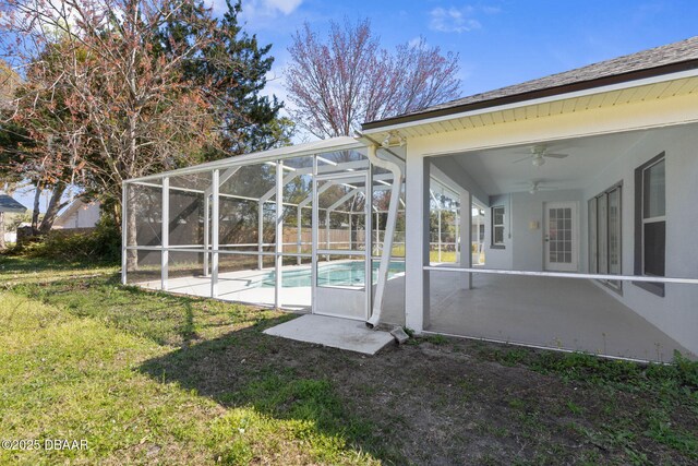 12 Patuxent Pl, Palm Coast, FL 32164 - view of yard featuring a patio area, a ceiling fan, a fenced in pool, and a lanai
