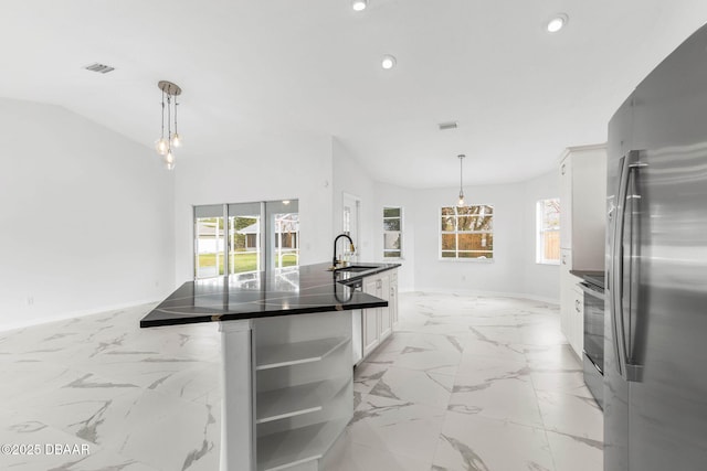 12 Patuxent Pl, Palm Coast, FL 32164 - kitchen with dark countertops, visible vents, recessed lighting, appliances with stainless steel finishes, and a sink
