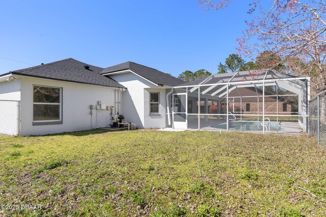 12 Patuxent Pl, Palm Coast, FL 32164 - rear view of property with a lanai, roof with shingles, stucco siding, a lawn, and an outdoor pool