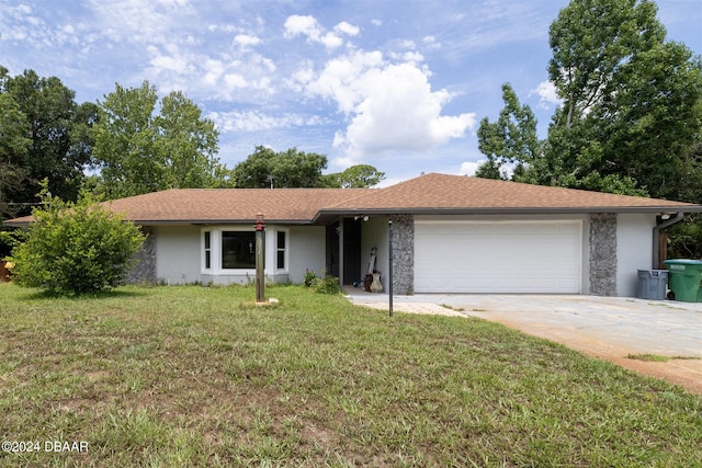 ranch-style house featuring a garage and a front lawn