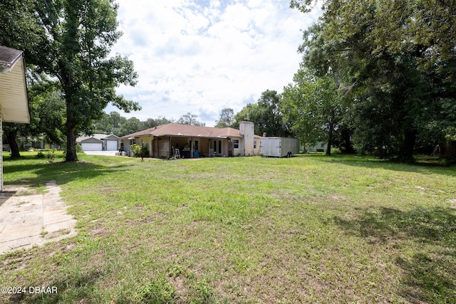 view of yard with a garage