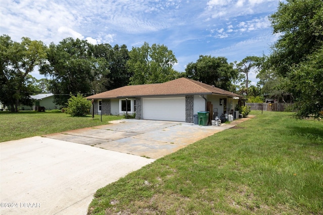 single story home featuring a front yard and a garage