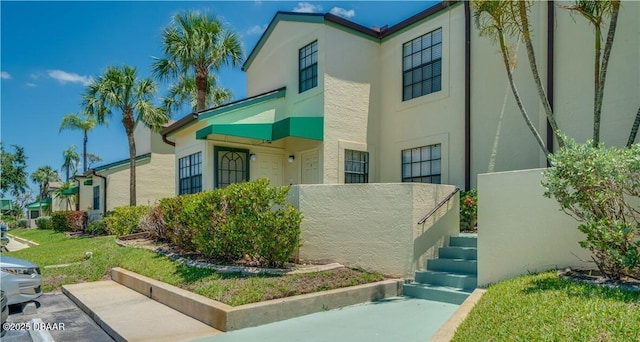 17230 Terraverde Cir Unit 7, Fort Myers, FL 33908 - view of front facade with stucco siding