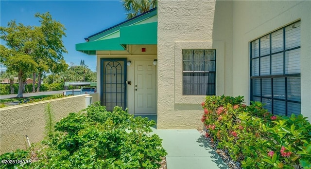 17230 Terraverde Cir Unit 7, Fort Myers, FL 33908 - view of exterior entry featuring stucco siding