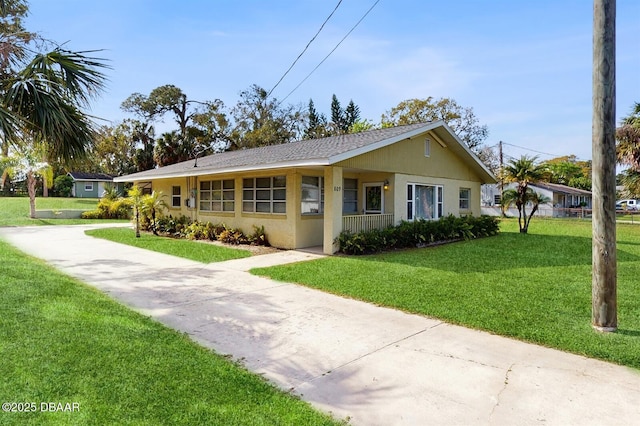 view of front of property with stucco siding and a front yard