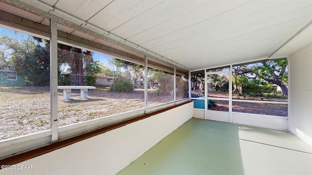 unfurnished sunroom with plenty of natural light