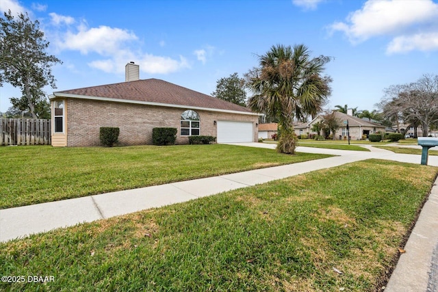 view of side of home with a garage and a lawn