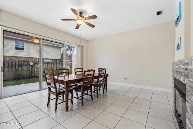 dining area featuring light tile patterned flooring and ceiling fan